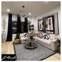 a black and white living room with a coffee table