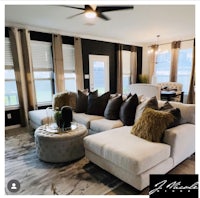 a living room with a white couch and a coffee table