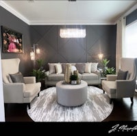 a living room with gray walls and furniture