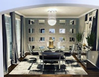 a dining room with gray walls and a chandelier