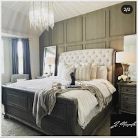 a bedroom with a king size bed and a chandelier