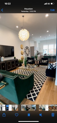 a photo of a living room with a couch and tv