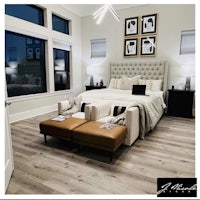 a bedroom with hardwood floors and a bed